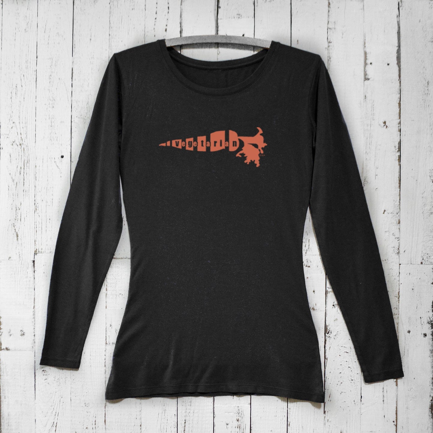 Black women's vegetarian long sleeve t-shirt with bold orange carrot graphic. Bamboo organic cotton shirt for eco-conscious plant-based fashion.