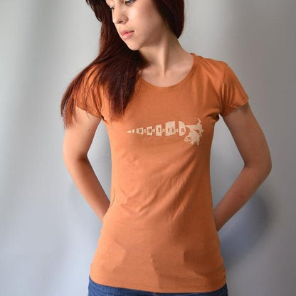 Rust orange bamboo cotton women's vegetarian T-shirt with white 'Plant Power' carrot design. Sustainable and stylish gift for healthy living.