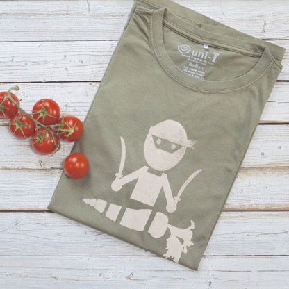 Men's Vegan T-Shirt in Bamboo & Organic Cotton in olive green with 'Veggie Ninja' graphic, folded on wood background with cherry tomatoes.