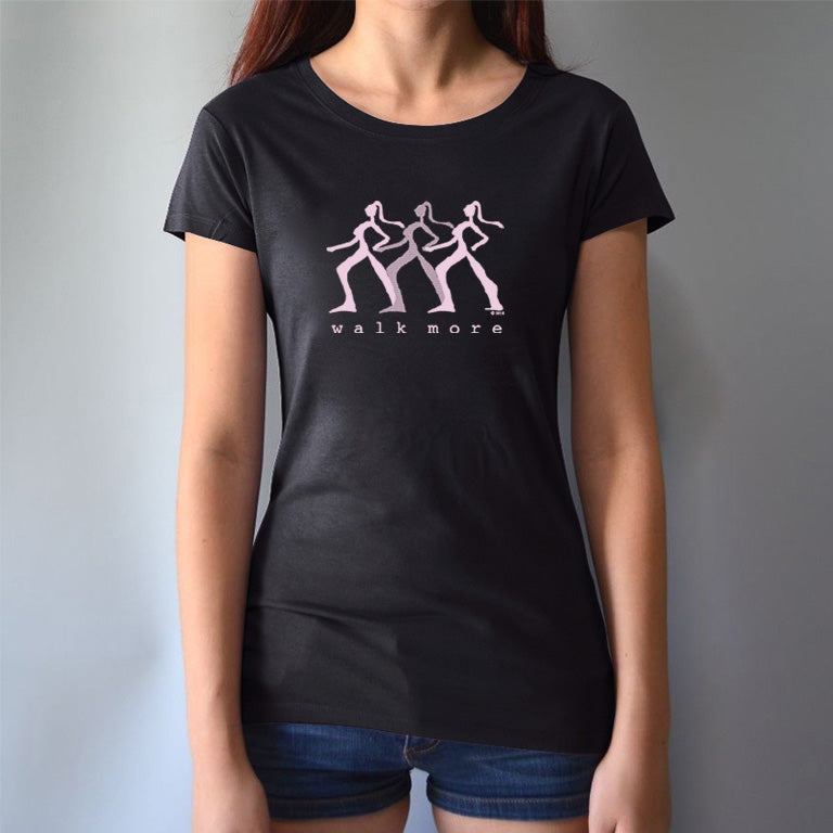 Black Women's Walking T-Shirt in Bamboo & Organic Cotton worn by model, featuring pink 'Walk More' print. Stylish sustainable fitness tee.