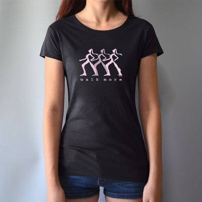 Black Women's Walking T-Shirt in Bamboo & Organic Cotton worn by model, featuring pink 'Walk More' print. Stylish sustainable fitness tee.