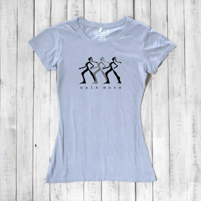 Light blue Women's Walking T-Shirt in Bamboo & Organic Cotton with black 'Walk More' silhouette design. Comfortable and eco-friendly top.