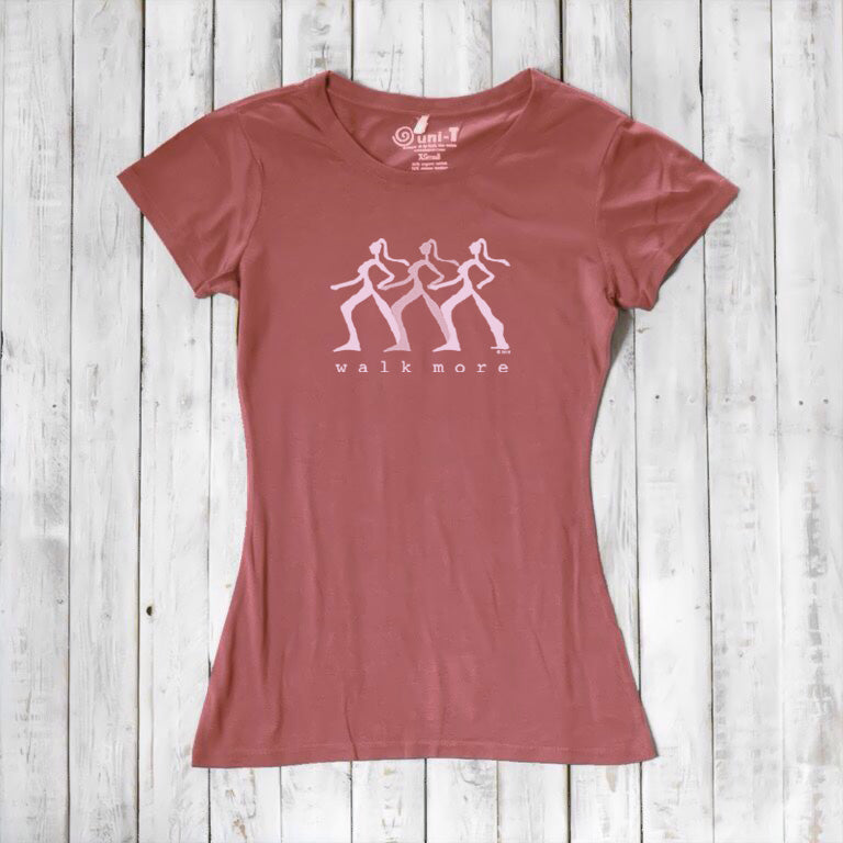 Red clay Women's Walking T-Shirt in Bamboo & Organic Cotton with white 'Walk More' print. Motivational and breathable hiking top.