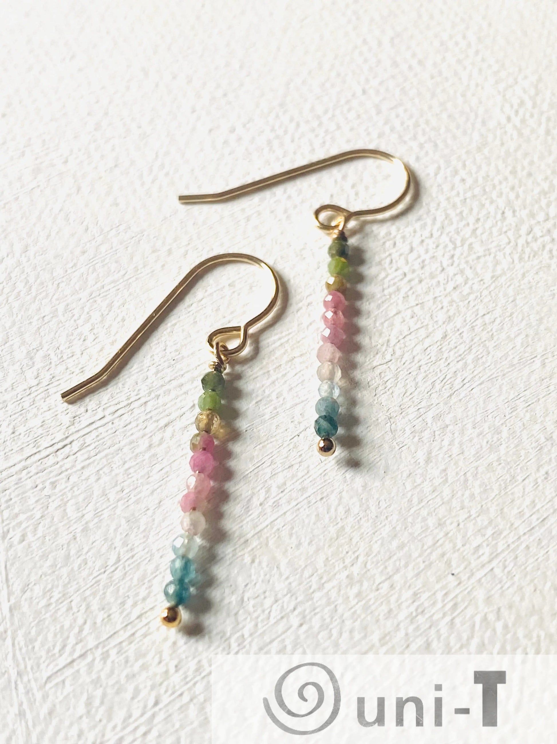 Delicate Glitter Stixx Earrings with genuine Watermelon Tourmaline beads and silver bar design, perfect for adding a pop of color to any outfit.