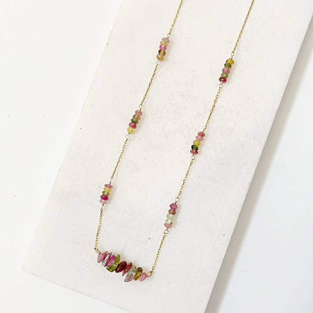 Close-up of Watermelon Tourmaline Necklace with vibrant pink and green beads spaced along a gold-filled chain for a floating effect.