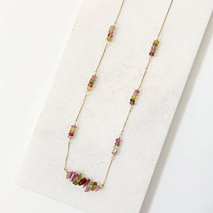 Close-up of Watermelon Tourmaline Necklace with vibrant pink and green beads spaced along a gold-filled chain for a floating effect.