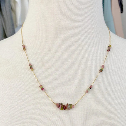 Floating Watermelon Tourmaline Necklace worn on a mannequin, highlighting its elegant pink and green gemstone design on a gold-filled chain.