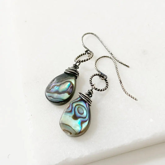 Sterling silver teardrop Rainbow Wire Wrapped Earrings featuring iridescent shell beads and twisted silver hooks, perfect for dangle earring lovers.