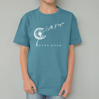 Teal Kids' Organic Cotton T-Shirt modeled by child, with white dandelion 'Wish More' graphic, eco-friendly flower tee by Uni-T.