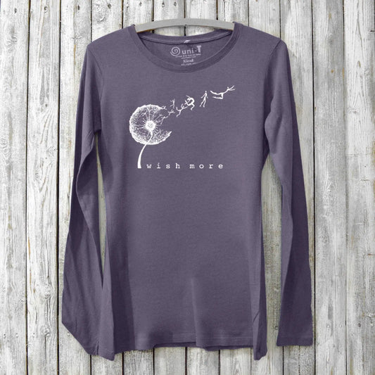Purple bamboo and organic cotton women's long sleeve tee featuring a white dandelion 'Wish More' design, perfect for mindful fashion lovers.
