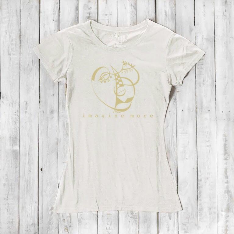 Ivory Women's Cubism Face T-Shirt in bamboo & organic cotton with subtle gold abstract face and 'imagine more' text. Minimalist art tee for women.