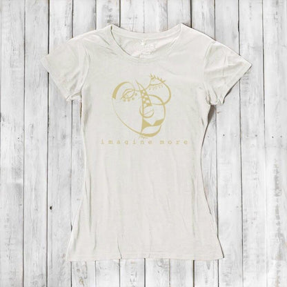 Ivory Women's Cubism Face T-Shirt in bamboo & organic cotton with subtle gold abstract face and 'imagine more' text. Minimalist art tee for women.