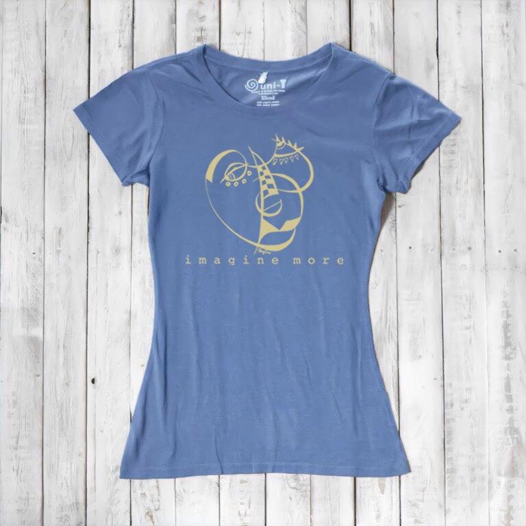 Periwinkle Women's Cubism Face T-Shirt in bamboo & organic cotton with gold abstract face and 'imagine more' text. Contemporary eco-friendly fashion.