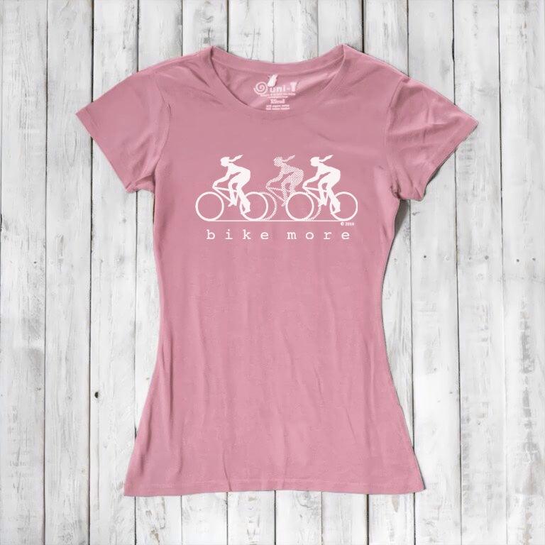 Pink Women's Bicycle T-Shirt in Bamboo & Organic Cotton featuring white 'Bike More' graphic. Eco-friendly tee for cyclists and active women.