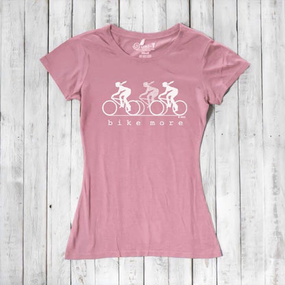 Pink Women's Bicycle T-Shirt in Bamboo & Organic Cotton featuring white 'Bike More' graphic. Eco-friendly tee for cyclists and active women.
