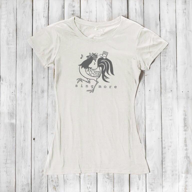 Ivory women's rooster t-shirt with 'Sing More' design, crafted from bamboo and organic cotton, perfect for eco-conscious singers.