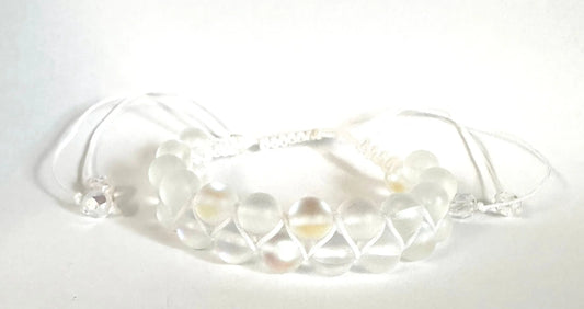 Adjustable woven bead bracelet with frosted white glass beads and white nylon cord. Elegant and versatile for everyday wear.