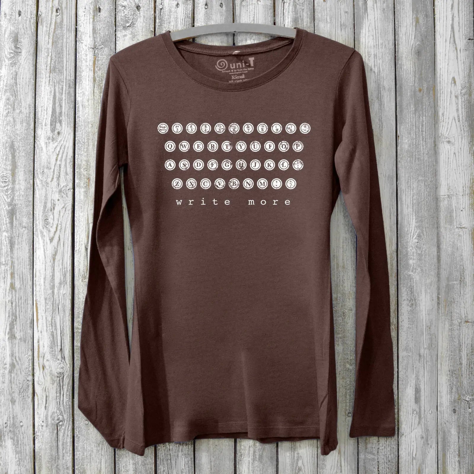 Dark brown bamboo and cotton Women's Typewriter Long Sleeve T-Shirt with vintage key design and 'Write More' message. Eco-friendly writer's apparel.