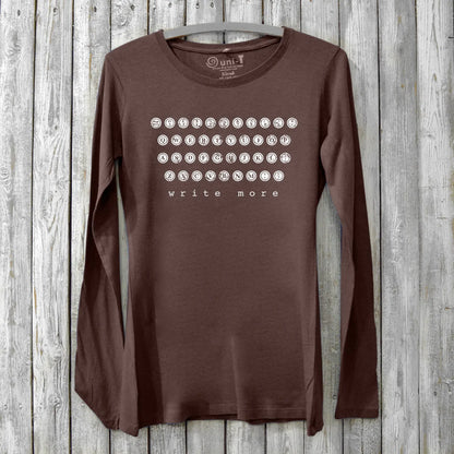 Dark brown bamboo and cotton Women's Typewriter Long Sleeve T-Shirt with vintage key design and 'Write More' message. Eco-friendly writer's apparel.