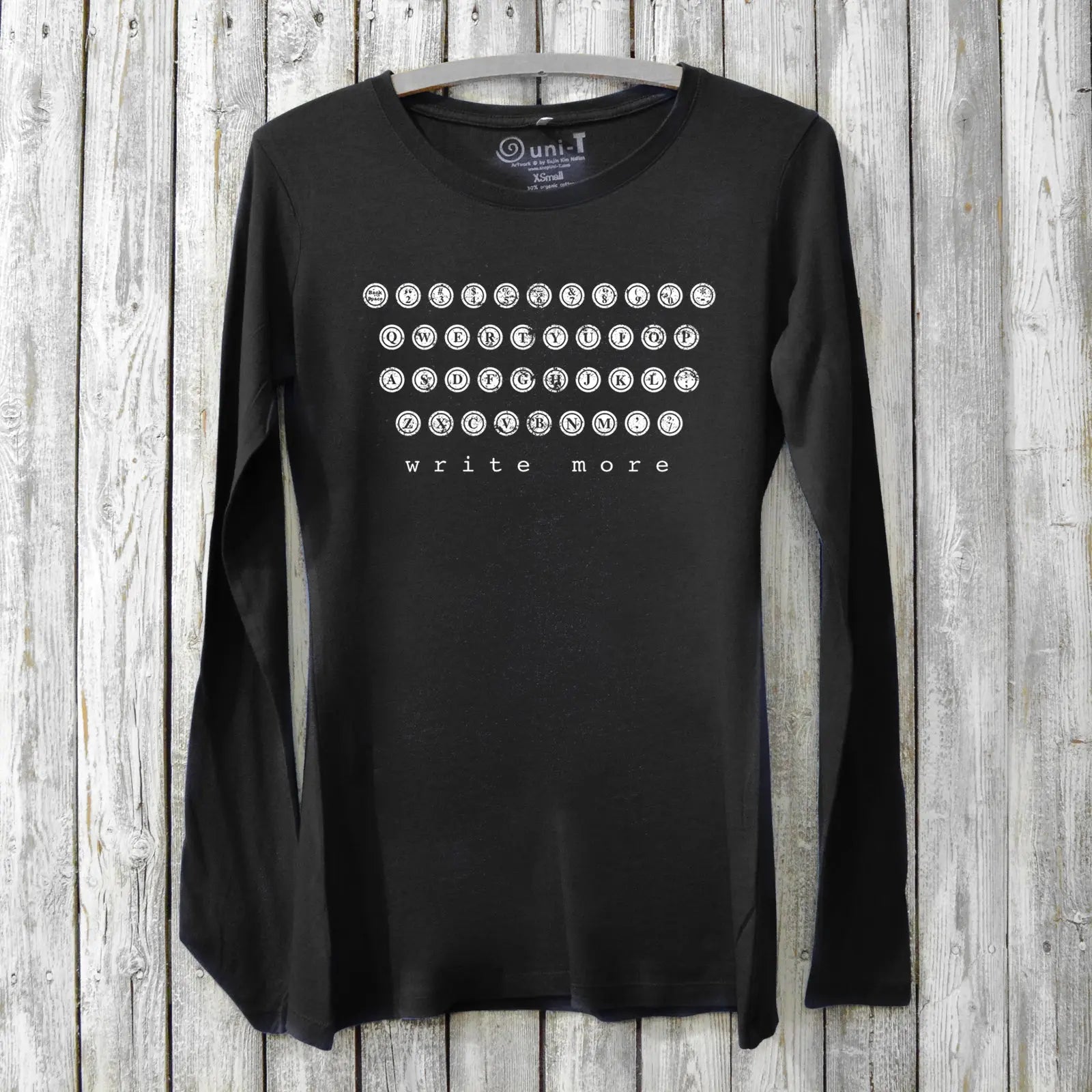 Black Women's Typewriter Long Sleeve T-Shirt in bamboo and organic cotton with white 'Write More' typewriter key print. Inspirational gift for creatives.