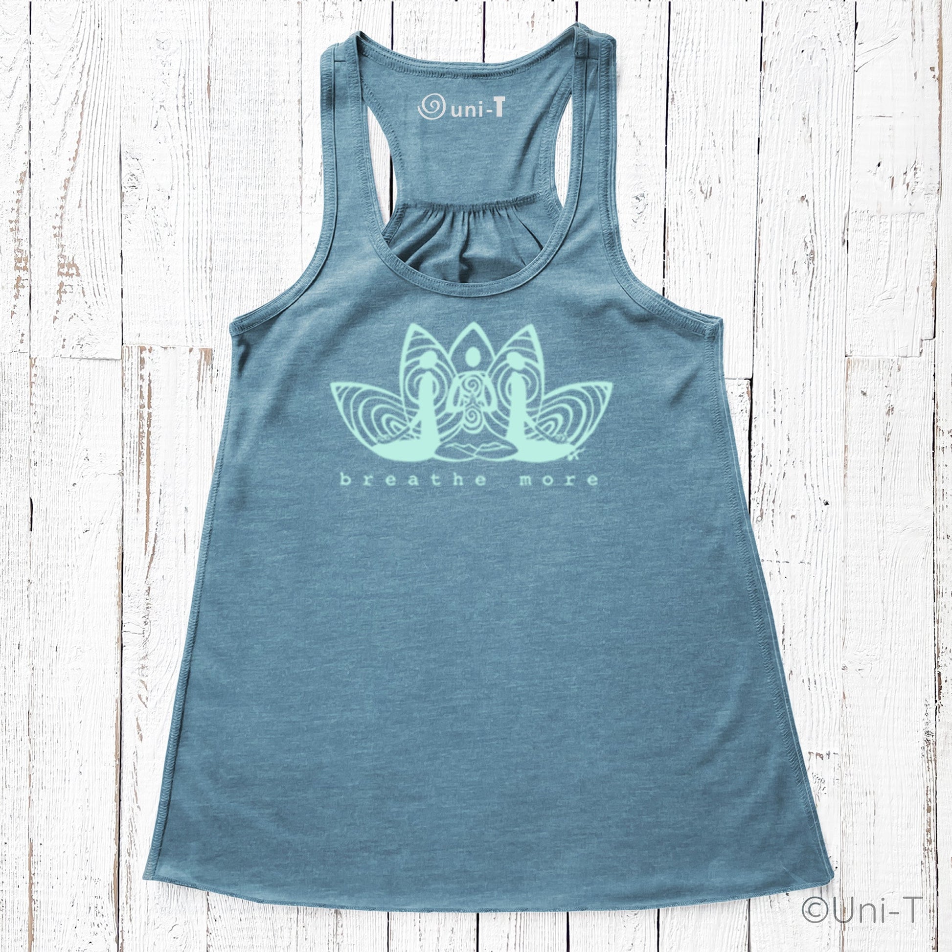 Blue Yoga Flowy Tank Top for Women with 'Breathe More' lotus design. Eco-friendly and soft fabric ideal for yoga and meditation wear.