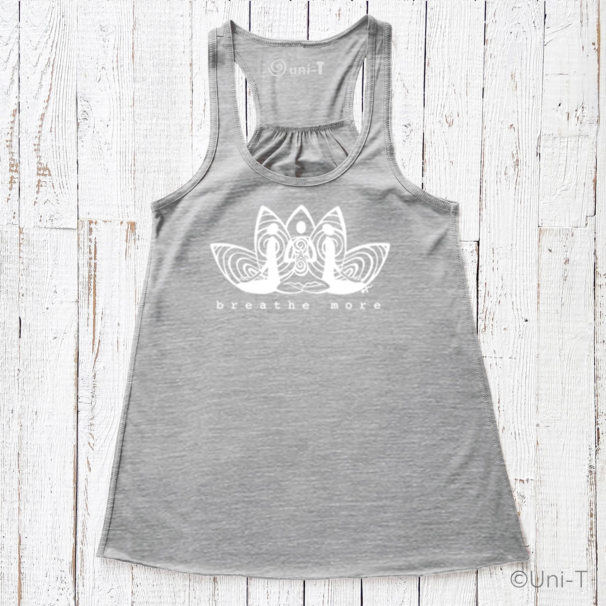 Grey Yoga Flowy Tank Top for Women featuring 'Breathe More' lotus artwork. Comfortable and sustainable yoga apparel.