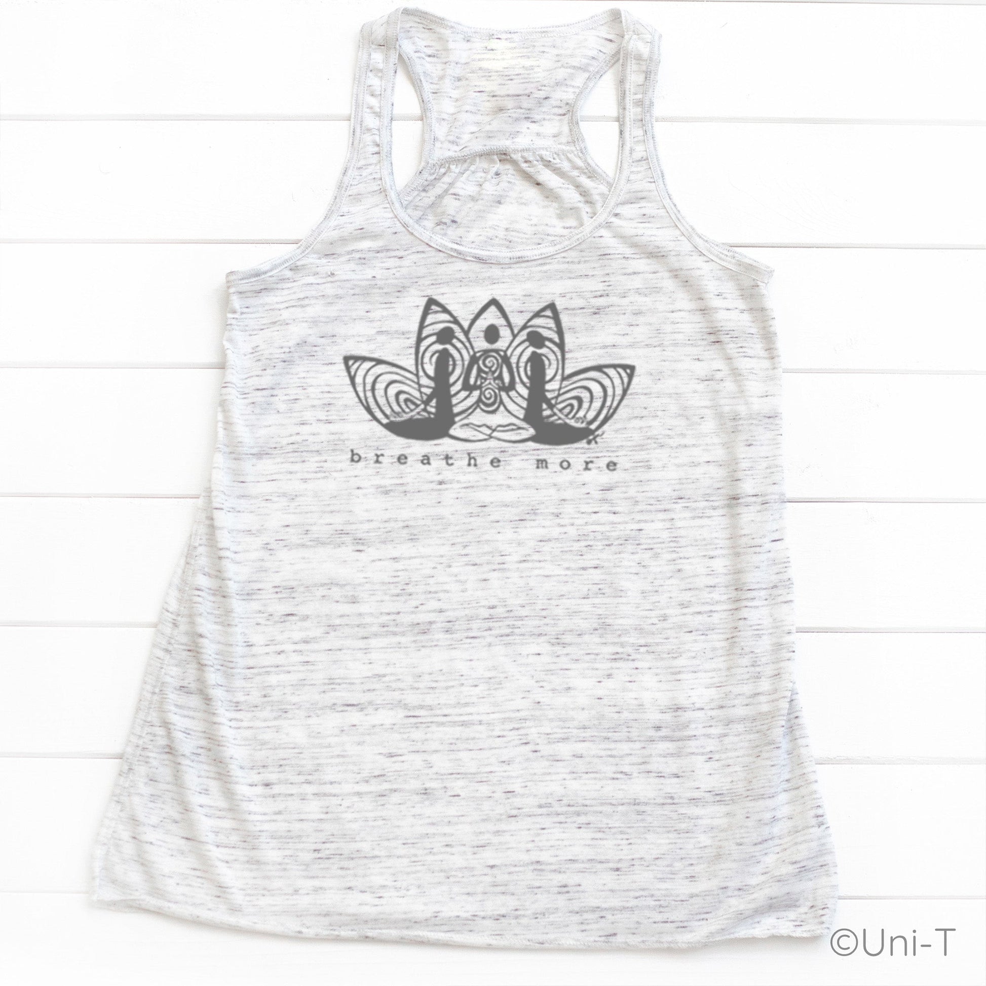 White speckled Yoga Flowy Tank Top Women with black 'Breathe More' design. Soft, eco-conscious top for meditation and yoga practice.