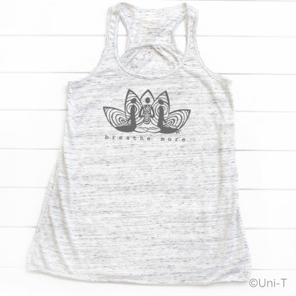 White speckled Yoga Flowy Tank Top Women with black 'Breathe More' design. Soft, eco-conscious top for meditation and yoga practice.