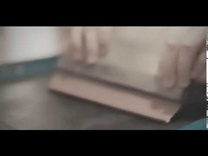 Screen printing process for 'Dream More' men's motivational t-shirt. Showcasing handcrafted quality in bamboo and organic cotton apparel.